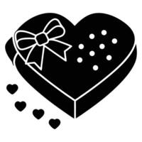 A black and white heart shaped box with a bow vector