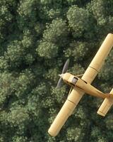 A orange airplane with visible wear ,tear flies over a dense green forest photo