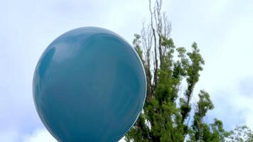 Teal balloon floating in the sky video