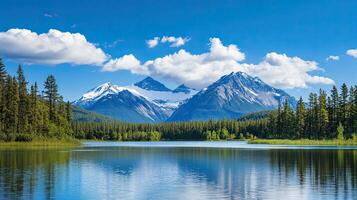A serene landscape with mountains, a clear lake, and lush greenery under a bright blue sky with fluffy clouds. photo