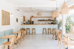 A restaurant with wooden tables and chairs photo
