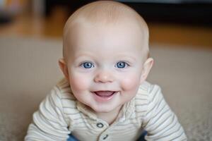 A baby smiling while laying on the floor photo