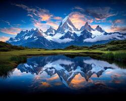 Majestic mountain landscape. Stunning panoramic view of snow capped mountain range reflecting in serene lake photo
