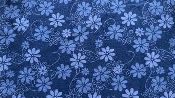A blue fabric with flowers on it.32 photo