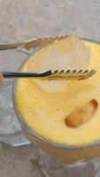 orange juice ice Stirring fresh orange Juice with ice. Healthy refreshment drinks. video