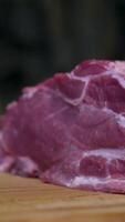 pork neck raw pork neck slice. The camera zooms in, revealing the intricate marbling patterns present in the meat. The marbling refers to the delicate lines of fat that run through the muscle fibers video
