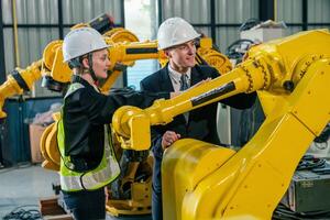 Engineers collaborate in a robotics workshop, discussing automation and technology advancements in the facility photo