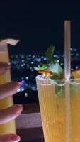 City Lights and Celebration, Two Drinking Glasses in New Year Campaign, Raise a toast against backdrop of city lights with two elegant drinking glasses, setting the scene for a festive New Year video