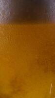 Super slow motion of pouring beer into pint in motion. Filmed on high speed cinema camera. Camera placed on high speed cine bot. Speed ramp effect. video