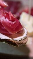 ham beer casual scene in a bar showcases a sandwich filled with ham, accompanied by glasses of beer on a wooden counter, reflecting a relaxed and informal dining experience. video