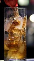 Cola add Cola to rum and ice alcoholic cocktail with ice, dark rum, lime and coca cola. adding soda to highball video