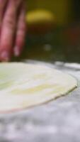 roll out dough, thin layer process of croissant preparation.starting with adding flour, in dough mixer,is rolled out thinly.after laminating,dough is chilling.many croissant on tray.4k video