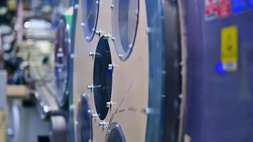 Large diameter rotating mechanism at the diaper production enterprise. Technological equipment for modern nappies manufacturing in blur. video