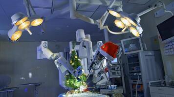 Hi-tech machine for surgical operations makes precise moves to decorate Christmas tree. Futuristic equipment perform delicate work. Robotic machine in the operation room. video