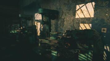 Machinery illuminated by sunlight in an abandoned workshop setting video