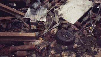 Cluttered heap of scrap metal and discarded objects in an abandoned workshop video