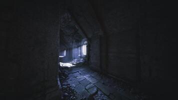Light filters through a ruined structure in a dark corridor at dusk video