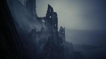 Ruins of an ancient castle overlooking a misty coastline at twilight video