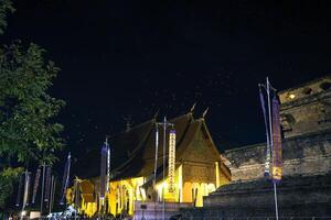 The northern Thai temple is surrounded with Yipeng, or floating lanterns. photo