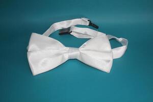 Bow tie placed on a faded green background photo