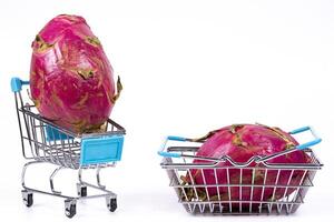 Unique fruits in shopping carts create a quirky market display photo