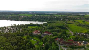 Drone view Pilsensee See in Bayern, Seefeld, Hechendorf Deutschland Luftaufnahme. Aerial view of lake Pilsensee shared lake area with Lake Ammer in Bavaria, Germany near Munich. video