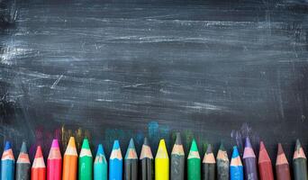 Colorful Crayons on Blackboard Background with Artistic Chalk Marks and Patterns photo