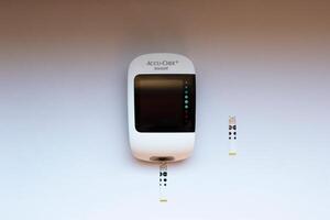Poznan, Poland - 10.20.2022 Accu-Chek Instant blood glucose meter close-up photo