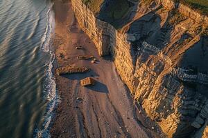 Coastal Cliff Casting Shadows on Beach Below nature background photo
