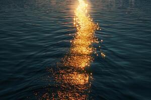 Seascape Sunlight creating golden path on the surface of calm lake  nature background photo