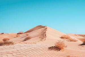 Stunning Desert Landscape with Towering Sand Dunes and Sparse Vegetation Under a Clear Blue Sky   nature background photo