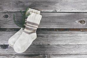 Handmade warm knitted socks of wool yarn photo