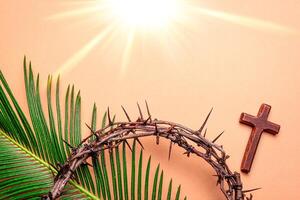 crown of thorns, christian cross and palm leaves. Holy Week. photo