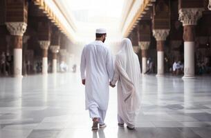 Portrait of a Muslim couple in white Ihram garments at a sacred site, reflecting their devotion and unity during pilgrimage.Generated image photo