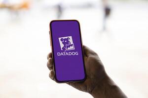 Dhaka, Bangladesh, 11 Aug 2024- DataDog logo is displayed on smartphone. Datadog is a SaaS platform that monitors cloud applications. photo