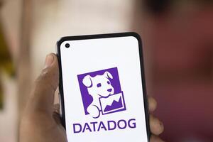 Dhaka, Bangladesh, 11 Aug 2024- DataDog logo is displayed on smartphone. Datadog is a SaaS platform that monitors cloud applications. photo