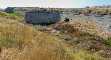 The ruins of the ancient Arabat fortress in the eastern Crimea on the shore of the Sea of Azov photo