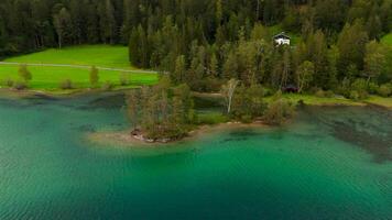 Hintersteiner See mountain lake in Austria near town of Kufstein, aerial view in summer at sunset in cloudy weather. Hintersteiner See in Oesterreich in der Nahe der Stadt Kufstein Luftaufnahme. video