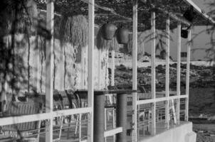 Black and withe Restaurant by the beach early in the monnring in summer photo
