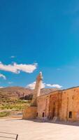 Divrigi Ulu Camii or Great Mosque of Divrigi time lapse vertical footage with motion of the clouds and people. video