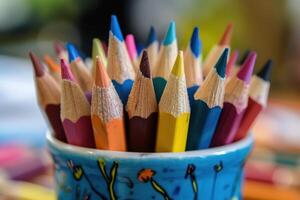Vibrant Collection of Artist Pencils in a Cup, Ideal for Sketching and Illustration photo