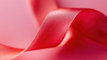 A detailed shot of a bright red ribbon standing out against a differing background photo