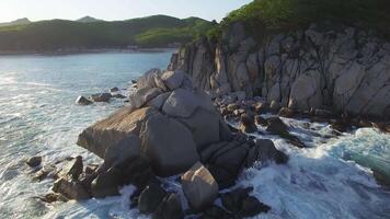 View from a droneon a stone cape washed by strong waves video