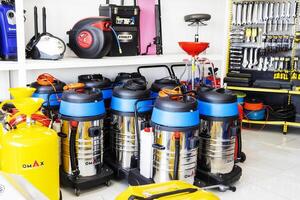 BAKU, AZERBAIJAN - May 20, 2022. Electrical equipment, high-pressure devices for washing cars by Omax are on sale in the store photo