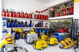BAKU, AZERBAIJAN - May 20, 2022. Electrical equipment, high-pressure devices for washing cars by Omax are on sale in the store photo