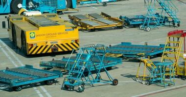 Qatar Doha 06.11.2024 airport Runway Qatar Airways planes loading luggage view from the window Launch zone workers at the airport video