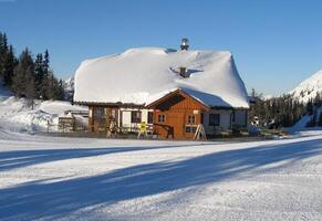Snowy Mountain Property with House and Trees in Rural Area photo