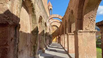 Tilt up view Arched columns and old brick wall of Odzun Church. Armenian basilica constructed around the 5th 7th century in the Odzun village of the Lori Province of Armenia video