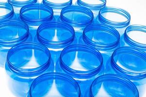 Blue plastic jars on a white background isolate, polyethylene terephthalate, tara photo