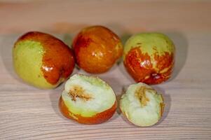 Bitten and wormy Chinese dates, jujube. photo